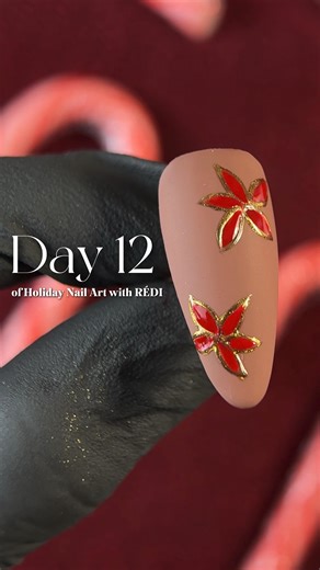 RÉDI by Red Iguana • HEMA-Free & Hypoallergenic Nail Products on Instagram: "✨ 12 Days of Holiday Nail Art with RÉDI ❤️ Day 12 ✨ Today’s look is Poinsettia Bloom 🎄 A soft nude base paired with hand painted poinsettia florals, gold outlining, and festive red accents for a classic holiday finish. RÉDI Product Recipe 💅🧪: • Soft nude base using RÉDI Color Gel: Mocha Mouse • Hand-painted poinsettia petals using Red Bottoms Color Gel • Gold outlining with our gold chrome • RÉDI Non-Wipe Top Coat an