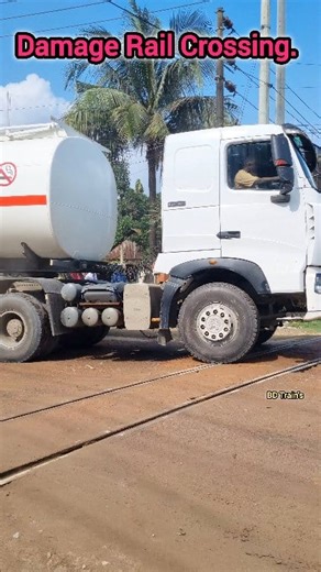 The huge vehicle passed over the damaged railroad crossing. #trains #ontario #art #rurallife #naturelovers #artist #usa #familyfriendly #fall #railway | BD Train's