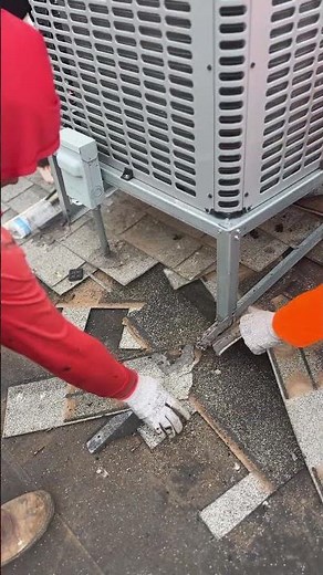 Watch roofer remove old shingles underneath an HVAC unit during a roof replacement! 🏡 #roofing