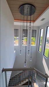 Custom staircase and lighting in beautiful home.