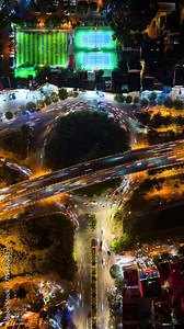 Aerial time-lapse of evening traffic at an intersection in Hanoi, Vietnam.