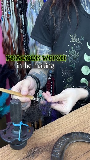 BasiliskHairs | Pro Dreadlocks Team • Shop on Instagram: "Peacock Witch – handmade witchy dread extensions in progress 🦚 This set features a dark peacock-inspired color palette with amethyst purple, deep teal, and rich burgundy accents on a dark brown base. The video shows the real handmade process – creating dread extensions, textured braids including fishtail braids, and adding non-brushable curls for a raw, organic look. 🌙 Decorated in our LUNAR WITCH style with real turquoise gemstone, moo