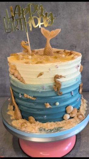 An ocean-inspired cake brought to life with hand-crafted sugar paste sea elements, edible sand, and a soft blue ombré buttercream finish to create movement and depth, just like the sea. A dreamy design perfect for a magical birthday celebration. 🐚✨ #OceanCake #SeaThemeCake #ButtercreamCake #OmbréCake #UnderTheSeaCake CustomCake BirthdayCake CakeArt HandmadeDetails SugarPaste EdibleArt InstaCake CakeDesign SweetCreations | Sunday's Cookies and Cakes