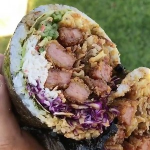 1.4M views · 7.5K reactions | Crispy Spam Musubi BURRITO! This favorite from Project Poke Co (Fountain Valley, CA) features deep-fried and breaded Spam, lettuce, red cabbage, imitation crab meat, cucumber, tomago, crispy wonton, onion, and eel sauce tightly wrapped in furikake laced sushi rice and nori! // #foodbeast @noodsnoodsnoods  @dailyfoodfeed | Foodbeast | Facebook