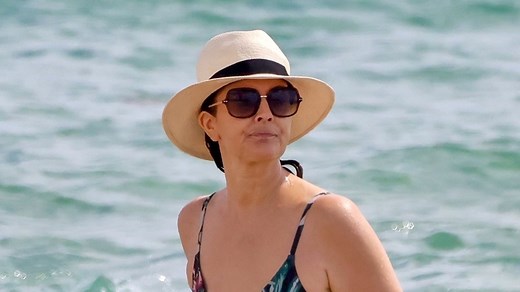 Drew Barrymore, 50, reveals fit figure and rarely-seen back tattoo in Miami