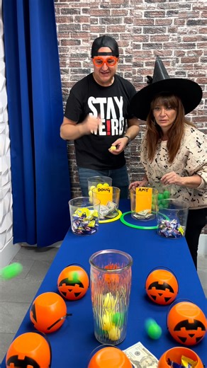 Halloween prize game where players throw ping pong balls into a vase for candy and cash This original video was produced by Doug and Friends and Network Media | All About Games
