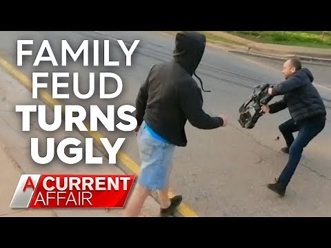 Cameraman shoved to ground in heated confrontation | A Current Affair