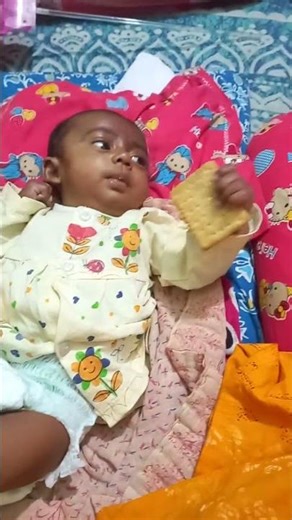 This little baby ate the biscuit.