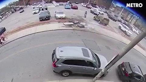 Shocking moment manhole cover explodes nearly taking out woman pushing stroller