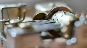 Music box clockwork mechanism close up on turning barrel & cogs. Stock Video