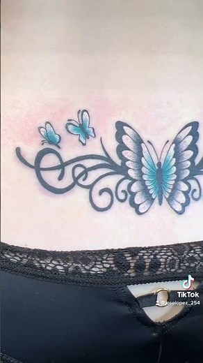 Tramp Stamp Tattoo with Blue Butterflies & Swirls | Lower Back Tattoo by Mi Vida Tattoos