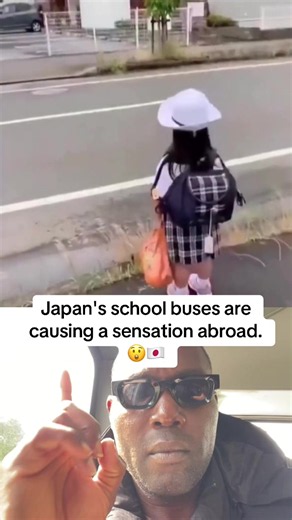 A Japanese schoolgirl in her crisp uniform and white hat waits by the roadside as a rainbow-painted bus with a giant smiling cartoon face pulls up. She carefully climbs the low steps with a staff member's help, turning an ordinary morning ride into childhood magic. Japanese kindergarten and early elementary buses often feature bright characters, animals and colorful designs to make the daily commute feel exciting. Their cheerful look has gone viral worldwide for putting kids' comfort and excitem