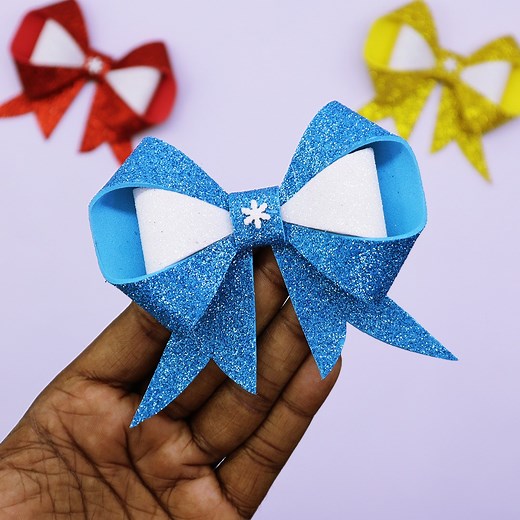 52K views · 2.6K reactions | Amazing Eva Glitter Foam Bow/Ribbon making for Christmas Decorations or Christmas Gifts Decor. It's a very easy and simple unique Hair Bow-making tutorial. DIY Christmas Crafts. | Colors Paper | Facebook