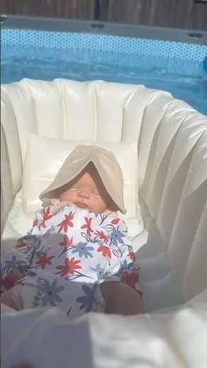 Silicone Baby Doll Relaxes With Pool Floatie