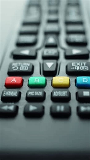 clip-4010892253-close-up-vertical-shot-tv-remote-control-camera