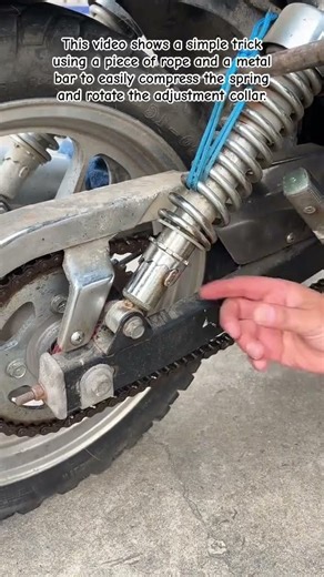 Loop a strong rope through the shock spring #MotorcycleHacks #MotoMaintenance #BikeLife #DIYGarage