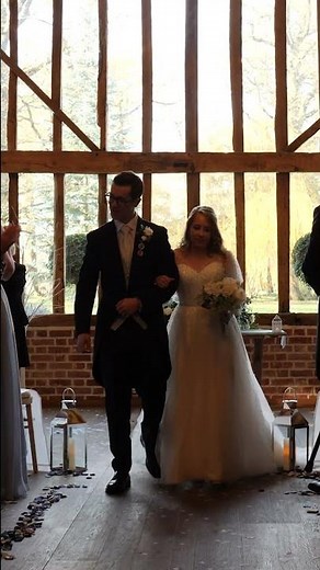 Bride & Groom Walk Up The Aisle and Stop to Share a Kiss