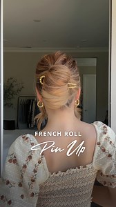French Roll Pin Up 💁‍♀️ Gather your hair into a ponytail and secure it with a hair tie. Pull the hair tie down slightly to make it looser. Create a horizontal opening behind the hair tie using your thumb and index finger. Push the ponytail through the opening (like a sideways topsy tail). Gather the ends of the ponytail and secure them with a clear elastic. Wrap the ponytail over the hair tie; rolling and tucking it into itself to form a French twist. Hook your hair pin on a small section of ha