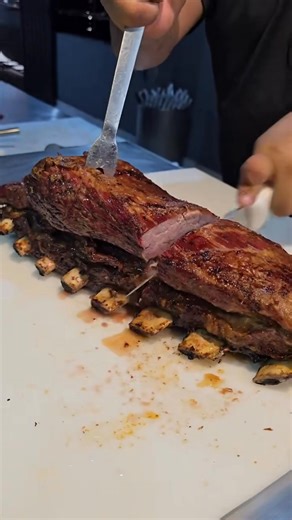 Costela de Churrasco 📍Mato Grosso, Brazil 🇧🇷 Learn More: www.tasteatlas.com/costela A traditional Brazilian barbecue dish made from beef ribs cooked slowly for several hours over charcoal or wood fire. The long, gentle roasting allows the fat to melt and baste the meat, giving it a smoky aroma and tender texture. It’s one of the highlights of a typical churrasco, often served in generous portions at family gatherings and weekend feasts. via @buteco_da_costela | TasteAtlas