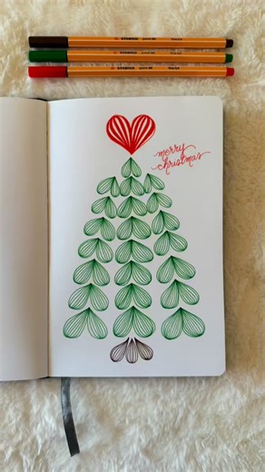 Jenny | ✨Mindful Doodling + Creative Calm✨ on Instagram: "A quick Christmas 🌲doodle with a ♥️that’s a little too big for the tree but that’s ok, right?🤭🫶 Comment PEN for the link to my favorite @stabilousa roll up set. Thank you for being here! 🥰 #zendoodle #zentangleinspiredart #zentangledoodle #zentanglepatterns #doodleart"