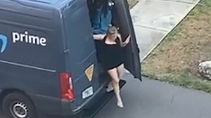 Woman slinks out the back door of an Amazon delivery van in Tampa