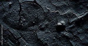 Rough rocky darkness. Dark crumpled texture surface. Used as a background and texture.