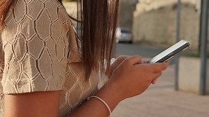 Girl texting on her phone - Free Stock Video Footage | Coverr