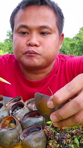 Delicious Snail Dish Preparation with Flavorful Sauce