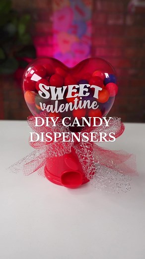 Who has spotted these mini candy dispensers at Dollar Tree Valentine’s section? 💕 You can make them extra cute by personalizing them using adhesive vinyl and a little bit of tulle 🥰 #dollartree #dollartreediy #dollartreefinds #diyproject #valentinesday #valentinesdiy #diyproject