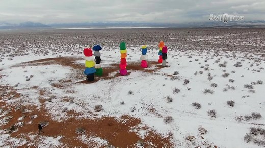 411K views · 15K reactions | SNOWY SEVEN: Seven Magic Mountains, a popular tourist attraction just south of the Las Vegas valley, stands tall amongst a snow-covered desert! Check out these views captured by our Avi8tor! | 8 News Now | Facebook