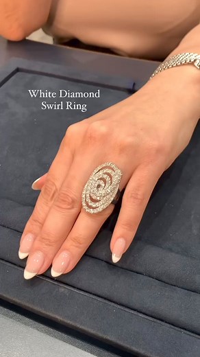 This elegant swirl design ring features 78 round brilliant cut white diamonds of G-I color with SI1-I1 clarity, totaling approximately 3.70 carats. The spiral design dazzles the eye with swirls of magnificent diamonds. This unique shape creates beautiful and dynamic movement while highlighting each gemstone. White diamonds such as these remain the most recognizable gemstones in the world, synonymous with desire, beauty and brilliance. Set in 18k white gold. Visit our website for more info. Item 