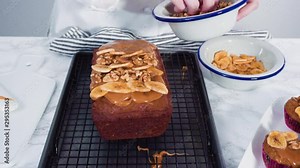 Step by step. Garnishing banana bread loaf with homemade caramel, banana chips, and walnuts.