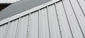 Laying Steel Roofing over Shingles the Right Way | DoItYourself.com