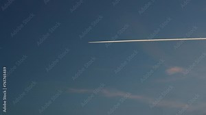 A contrail with a plane in the sky 4k 30fps video