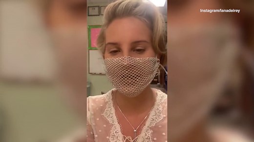 Video: Lana Del Rey wears compromising mesh face mask for book signing | Daily Mail Online