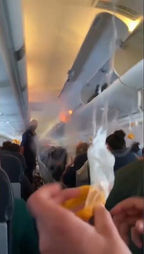 BREAKING: Overhead luggage catches fire mid flight ⚠️