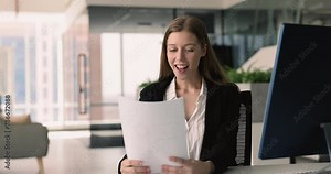 Businesswoman read document feels happy get positive result, achieve sales targets, received recognition award for her contributions or achievements in business, profit growth, professional successful