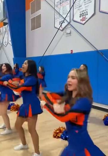 Girls Cheerleading Performance at Basketball Game