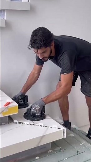 the process of installing ceramic tiles on the steps of a building #construction #popular #shorts