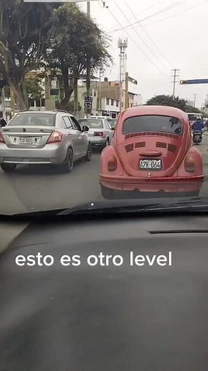 Exploring the Red Volkswagen Beetle in City Traffic