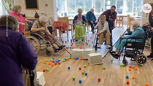 Seniors play human Hungry Hungry Hippos game while on lock down