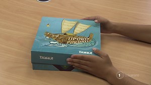 A new interactive board game called Upoko Pakaru will have your whānau singing, twirling poi, performing haka - maybe even trying charades! But, as Krystal-lee Brown reports, perhaps the biggest feature of Upoko Pakaru is that it's a game played in te reo Māori and it teaches Tainui history. | Te Karere