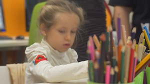 Littel girl working on the classroom - Free Stock Video