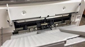 Industrial Printer printing out multiple copies of paper 4k