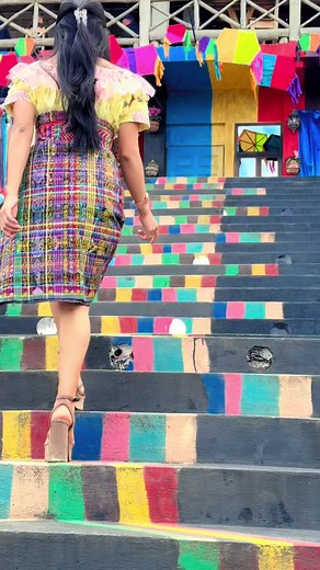 Colorful Journey: Woman Walking Up Vibrant Stairs