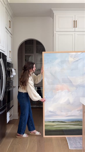 Minted on Instagram: "The perfect statement piece to brighten a home, framed in raw wood and ready to hang. @laurenemily wanted something personal and full of life, and she got just that with the "Living Skies" fine art print by independent #MintedArtist Nicole Walsh. Shop all fine art at the link in bio."