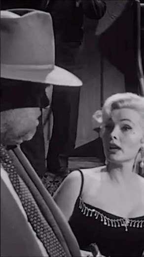 Zsa Zsa Gabor and Orson Welles in TOUCH OF EVIL (1958).