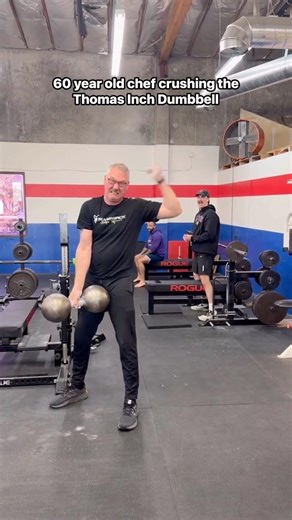 My dad lifting the Thomas Inch Dumbbell no problem!