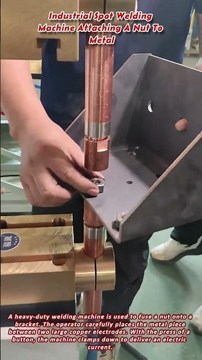 Industrial Spot Welding Machine Attaching A Nut To Metal