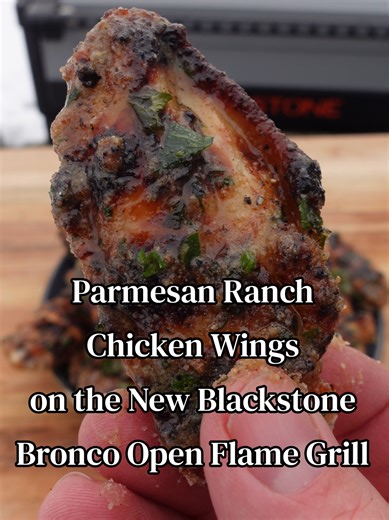 Wings will never be the same once you cook over the open flame. 😜 These Parmesan Ranch Chicken Wings started with a coating of Blackstone Parmesan Ranch and All Purpose Seasoning, then hit the New @Blackstone Griddles Bronco Open Flame for that smoky, crispy char. Finished with melted butter, fresh parsley, and a final dusting of Parmesan Ranch - then served with warm marinara for the ultimate dunk. 🛒 Now at Walmart. 👉 Follow @smoke_stone_cuisine for more open flame inspiration. #TheBroncoSer